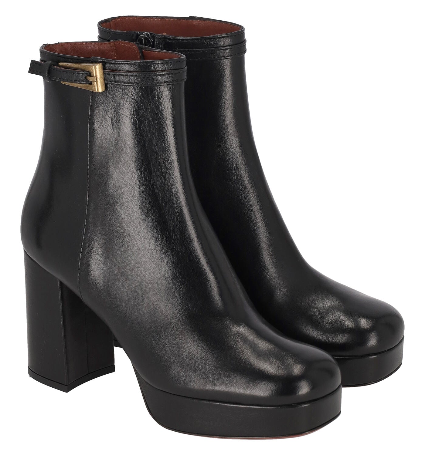 Tronchetto in pelle con fibbia , chiusura con zip . Taco largo altezza 8 cm .