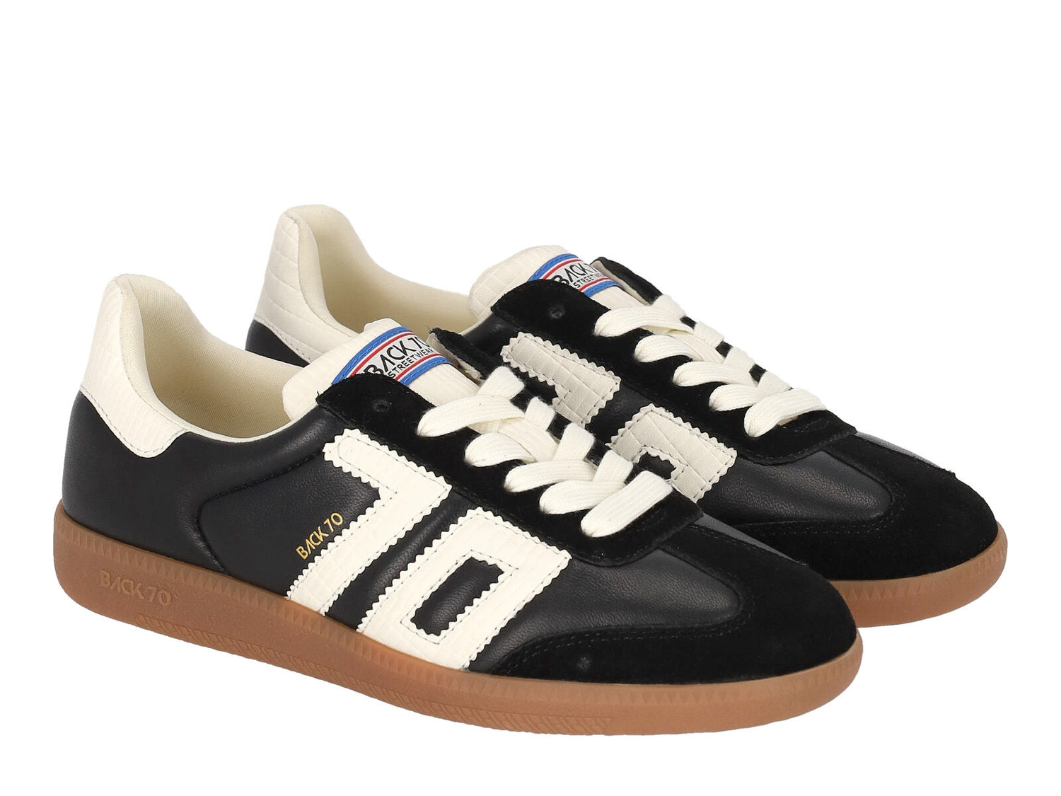 Sneakers in pelle e camoscio con riporto bianco.