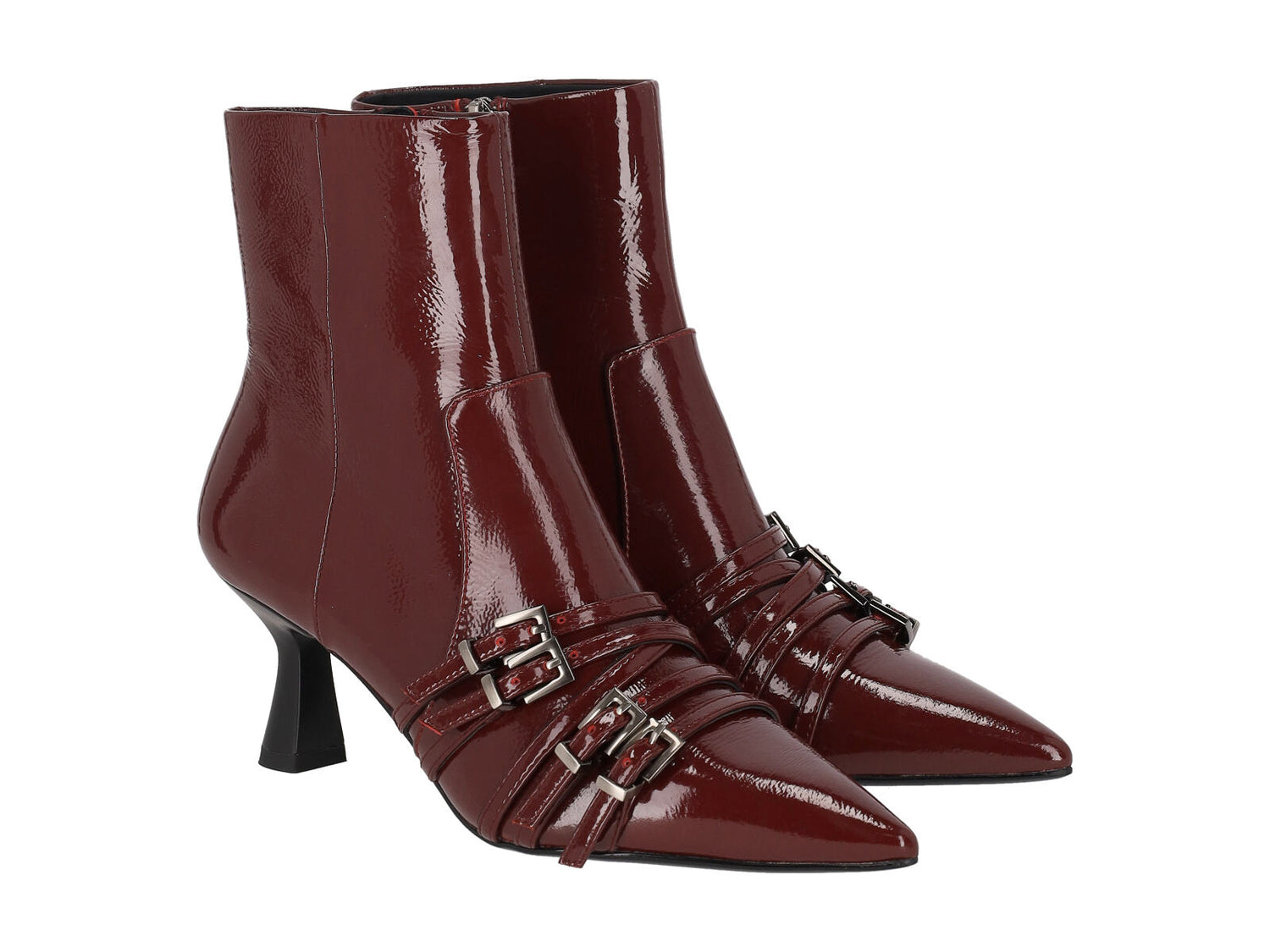 Tronchetto in naplak con fibbie in punta , chiusura con zip. Tacco altezza 6cm.