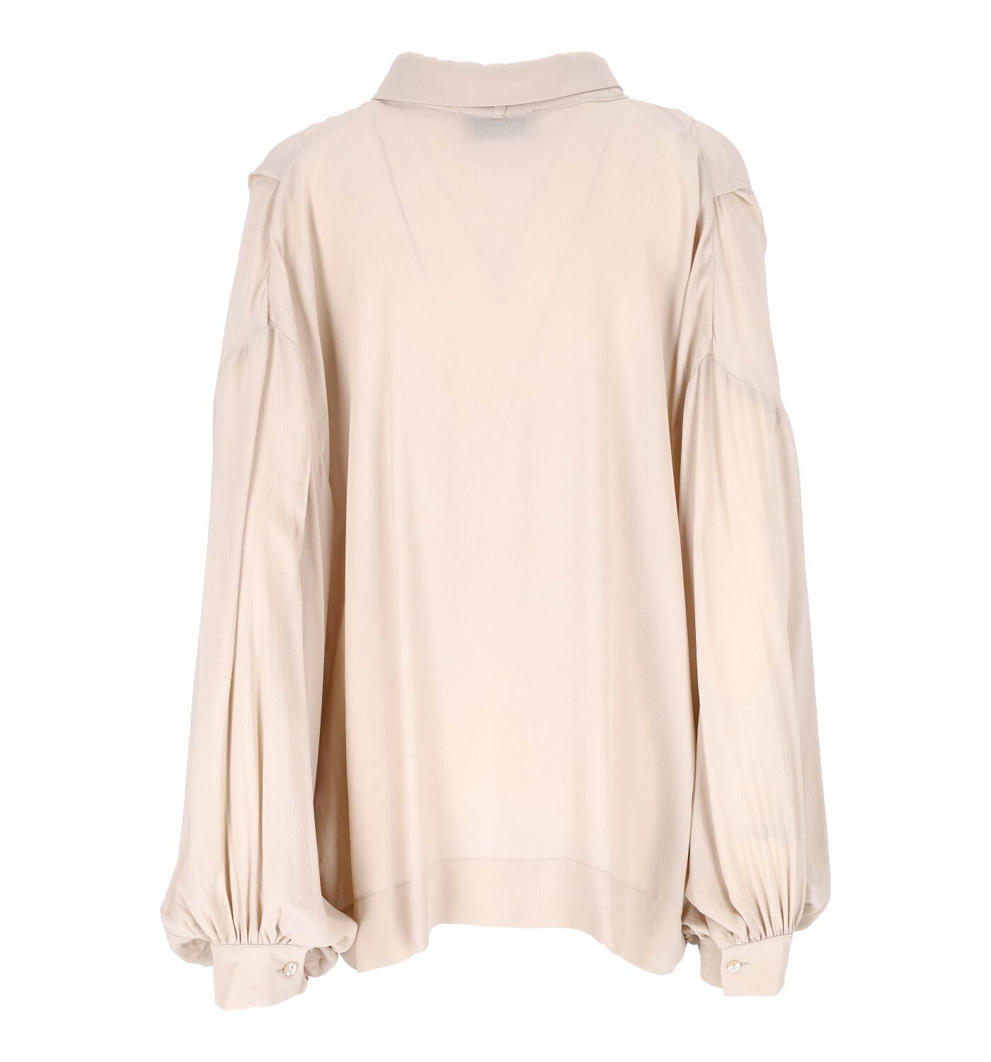 Blusa con laccetto in velluto al collo fermato da una spilla gioiello