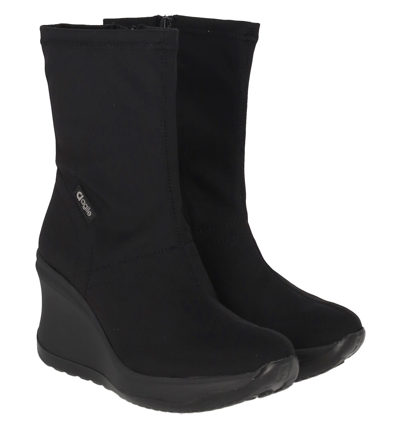 Tronchetto in tessuto elastico , zip a lato e zeppa altezza 8 cm.