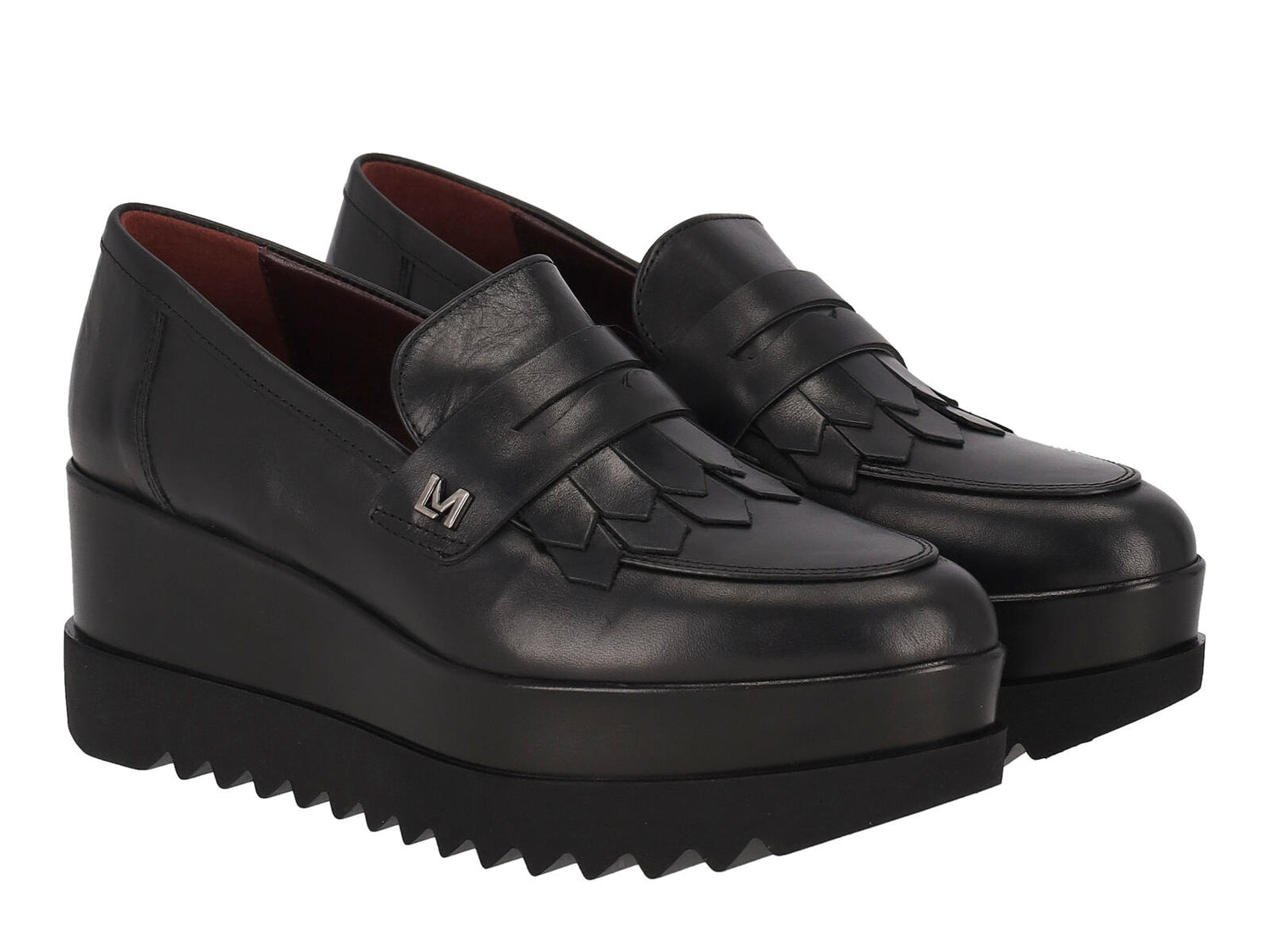 Mocassino in pelle con bendina , zeppa altezza 6 cm .