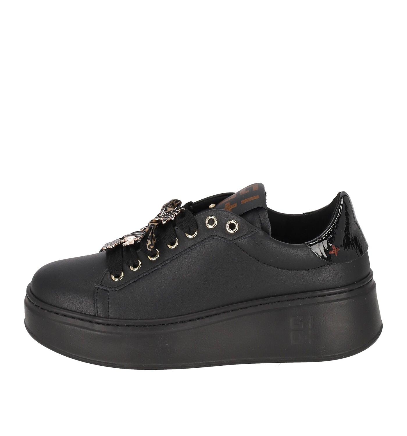 Sneakers nera platform con accessori